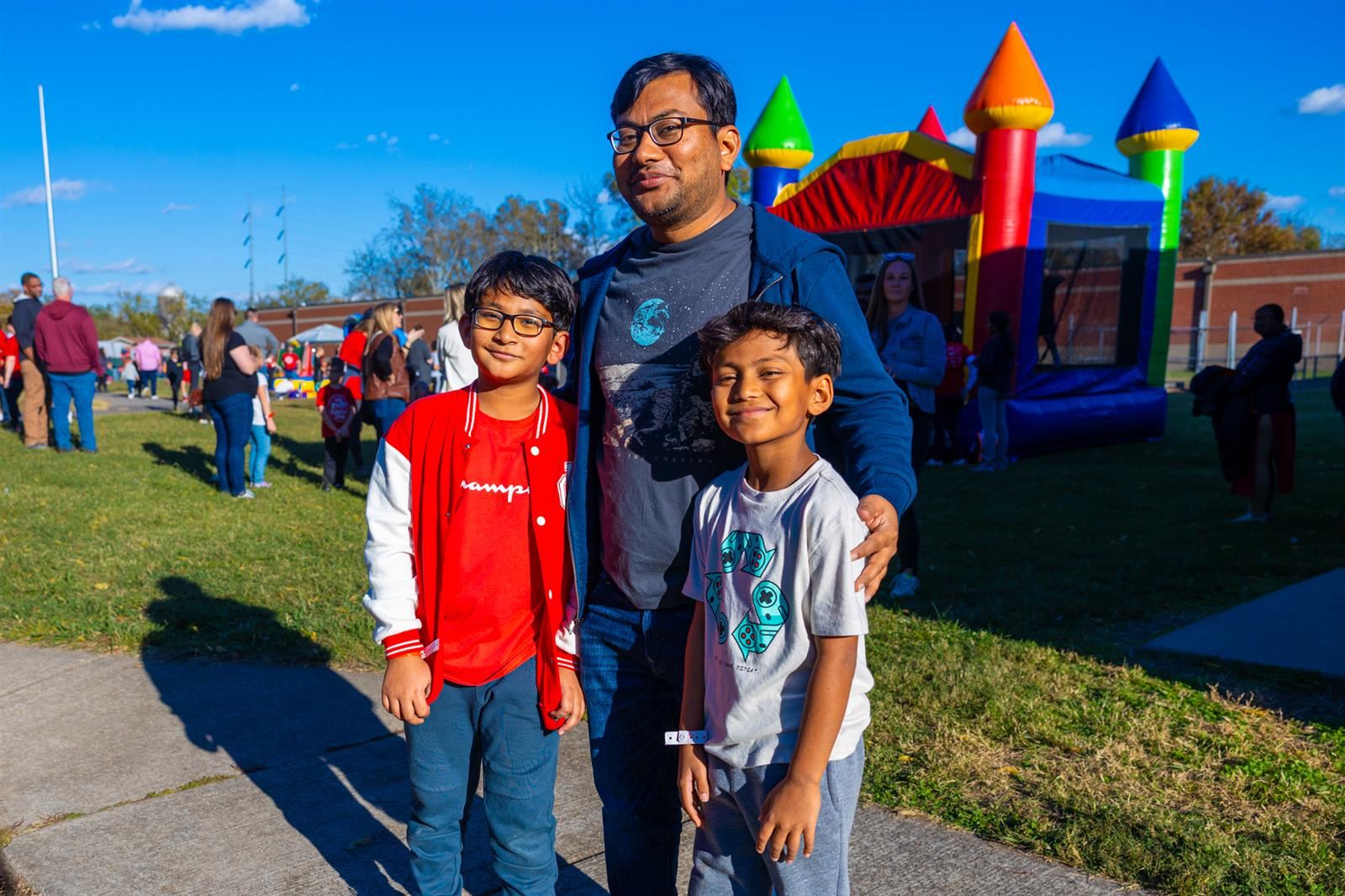 dad and two sons smiling